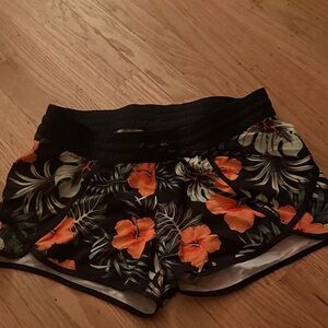 Dakine Black Board Shorts with Orange Hibiscus Print